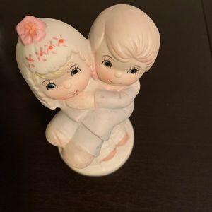 Bride Holding Groom Cake Top Figurine